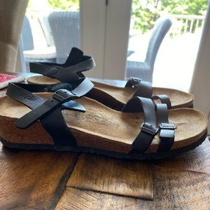 Black Birkenstock with a slight wedge heel